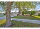 Well-manicured home with lush landscaping, and a three car garage at 13719 Artesa Bell Dr, Riverview, FL 33579