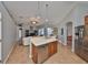 Open-concept kitchen offering a breakfast bar with sink, stainless steel dishwasher and views of the living area at 13719 Artesa Bell Dr, Riverview, FL 33579