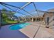 Private backyard featuring a sparkling swimming pool, screened enclosure, and a tranquil outdoor space at 13719 Artesa Bell Dr, Riverview, FL 33579