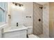 Bright bathroom with a modern shower, white vanity, and contemporary finishes at 1432 S Duncan Ave, Clearwater, FL 33756