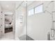 This shower has white subway tiles and modern fixtures, conveniently located next to the bedroom at 145 16Th Ne Ave, St Petersburg, FL 33704