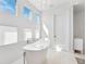 Bright bathroom boasts a freestanding tub with tile floors and three large windows at 145 16Th Ne Ave, St Petersburg, FL 33704
