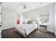 The bedroom features windows, gray carpet, and easy access to the ensuite bathroom at 145 16Th Ne Ave, St Petersburg, FL 33704