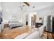 Spacious bedroom featuring vaulted ceiling, seating area, kitchenette, and stylish decor at 145 16Th Ne Ave, St Petersburg, FL 33704