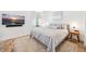 Comfortable bedroom with a large bed, stylish side table, and wall mounted TV for cozy nights at 145 16Th Ne Ave, St Petersburg, FL 33704