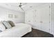 Bright, airy bedroom includes a ceiling fan and wall-to-wall closets for storage at 145 16Th Ne Ave, St Petersburg, FL 33704