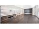 Upstairs bonus room boasts wood floors, natural light, and a modern railing overlooking the living area below at 145 16Th Ne Ave, St Petersburg, FL 33704