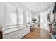 Spacious walk-in closet features custom shelving and drawers, plus a built-in vanity area with a sink at 145 16Th Ne Ave, St Petersburg, FL 33704