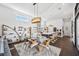 Open concept living space with decor shelving, dining table and chef's kitchen at 145 16Th Ne Ave, St Petersburg, FL 33704