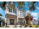 Inviting two-story home with white exterior, covered front porch, and lush landscaping for great curb appeal at 145 16Th Ne Ave, St Petersburg, FL 33704