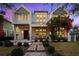 Stunning front exterior of home with vibrant bougainvillea and landscaped walkway at 145 16Th Ne Ave, St Petersburg, FL 33704