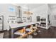 This modern kitchen showcases the island with eat-in bar, wine cooler and stainless appliances at 145 16Th Ne Ave, St Petersburg, FL 33704