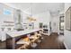 Sleek, modern kitchen featuring an island with seating, stainless steel appliances, and minimalist design at 145 16Th Ne Ave, St Petersburg, FL 33704
