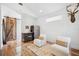 Cozy living area with modern kitchenette, comfortable chairs and vaulted ceiling at 145 16Th Ne Ave, St Petersburg, FL 33704