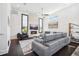 Spacious living room with a large grey sectional sofa and a fireplace at 145 16Th Ne Ave, St Petersburg, FL 33704