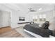 Serene main bedroom featuring wood floors, whitewashed walls, comfortable seating area, and a ceiling fan at 145 16Th Ne Ave, St Petersburg, FL 33704