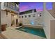 A private pool with built-in seating and water features at 145 16Th Ne Ave, St Petersburg, FL 33704