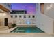 A private pool with built-in seating and water features at 145 16Th Ne Ave, St Petersburg, FL 33704