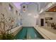 A private pool with built-in seating and water features at 145 16Th Ne Ave, St Petersburg, FL 33704