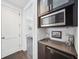 Convenient wet bar area with a microwave, sink, and mini-fridge, perfect for entertaining guests at 145 16Th Ne Ave, St Petersburg, FL 33704