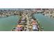 Aerial view of waterfront homes with boat docks and canals offering a scenic coastal setting at 16327 Redington Dr, Redington Beach, FL 33708