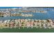Aerial view highlighting waterfront homes with boat docks and beautiful canal access at 16327 Redington Dr, Redington Beach, FL 33708