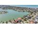 Stunning aerial view of waterfront homes and canals showcases the coastal lifestyle at 16327 Redington Dr, Redington Beach, FL 33708