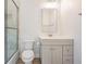 Bright bathroom featuring a glass shower and a light gray vanity at 16327 Redington Dr, Redington Beach, FL 33708