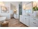 Bright bathroom features dual sinks, white cabinets, and a separate shower and tub at 16327 Redington Dr, Redington Beach, FL 33708