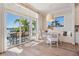 Bright dining area with access to outside seating, a view, and built in benches at 16327 Redington Dr, Redington Beach, FL 33708