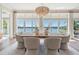 Dining room with waterfront views, natural light, and modern decor at 16327 Redington Dr, Redington Beach, FL 33708