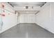 Large and clean garage with epoxy flooring offers plenty of space and storage potential at 16327 Redington Dr, Redington Beach, FL 33708