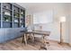 Stylish home office with custom built-ins, wood floors, and natural light at 16327 Redington Dr, Redington Beach, FL 33708