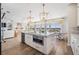 Bright, open-concept kitchen with island and views of water at 16327 Redington Dr, Redington Beach, FL 33708