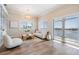 Comfortable living room with water views, recessed lighting, and hardwood flooring at 16327 Redington Dr, Redington Beach, FL 33708
