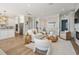 Open-concept living space with modern decor, hardwood floors, and ample natural light at 16327 Redington Dr, Redington Beach, FL 33708