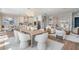 Open-concept living and kitchen area with bright lighting, modern appliances and decor at 16327 Redington Dr, Redington Beach, FL 33708