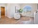 Sitting area features natural light, comfortable seating, and wood-look flooring at 16327 Redington Dr, Redington Beach, FL 33708