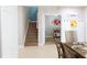 Bright dining area, with stairs and a view of a play kitchen, offering a welcoming view of the home's layout at 16918 Dorman Rd, Lithia, FL 33547