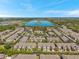 Vast aerial view of a Primary-planned community surrounding a serene lake at 2028 Kings Palace Dr # 202, Riverview, FL 33578