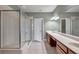 Bathroom featuring dual sinks with a large mirror, tile floor, and walk-in glass enclosed shower at 2028 Kings Palace Dr # 202, Riverview, FL 33578