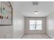 Bedroom features a window for natural light and a neutral color palette at 2028 Kings Palace Dr # 202, Riverview, FL 33578