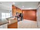 Bright kitchen features ample cabinet space, black appliances, and tile flooring at 2028 Kings Palace Dr # 202, Riverview, FL 33578