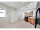 An expansive kitchen with tiled floors, stainless steel refrigerator and modern appliances at 2028 Kings Palace Dr # 202, Riverview, FL 33578