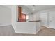 Bright kitchen with counter seating and views into adjacent living spaces at 2028 Kings Palace Dr # 202, Riverview, FL 33578