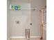 Basic laundry room with water heater, connections, and wire shelving at 2028 Kings Palace Dr # 202, Riverview, FL 33578