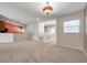 Open-concept living area with plush carpeting and access to other rooms at 2028 Kings Palace Dr # 202, Riverview, FL 33578