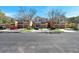 Charming row of townhouses with well-manicured lawns and ample parking on a tree lined street at 2028 Kings Palace Dr # 202, Riverview, FL 33578
