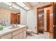 Bathroom featuring a sink and vanity, toilet, and walk-in shower at 2112 Laurence Dr, Clearwater, FL 33764