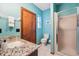 Bathroom with granite countertop, glass shower, and tile floor at 2112 Laurence Dr, Clearwater, FL 33764